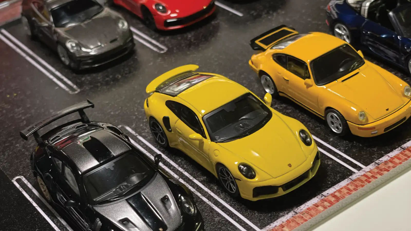 A premium collection of die-cast model cars representing different collector brands